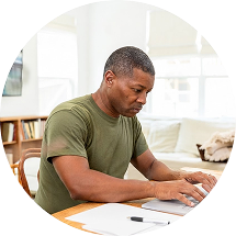 Nursing student studying online coursework on a laptop at home